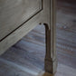 Wooden furniture leg on a wooden floor