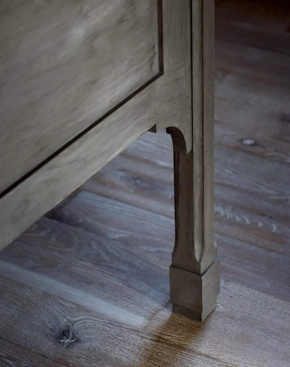 Wooden furniture leg on a wooden floor