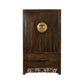 Wooden wardrobe with intricate carvings on a white background