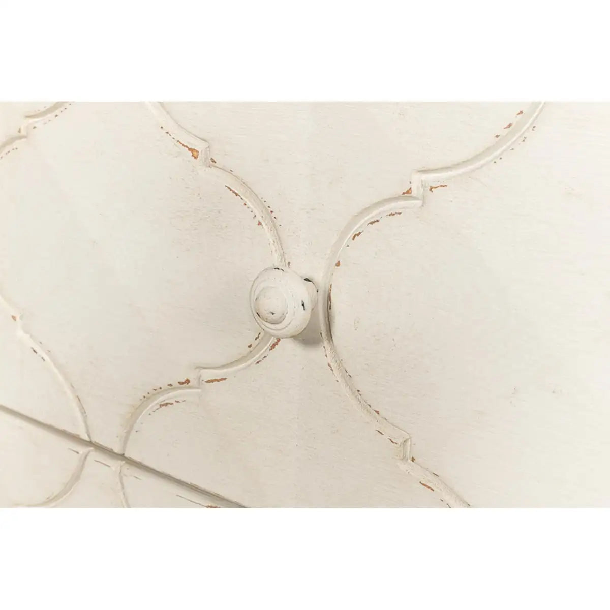 Close-up of a decorative headboard with intricate patterns on a white background