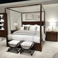 Bedroom with a four-poster bed, nightstands, and ottomans.