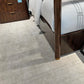 Bedroom with a bed on a textured gray carpet