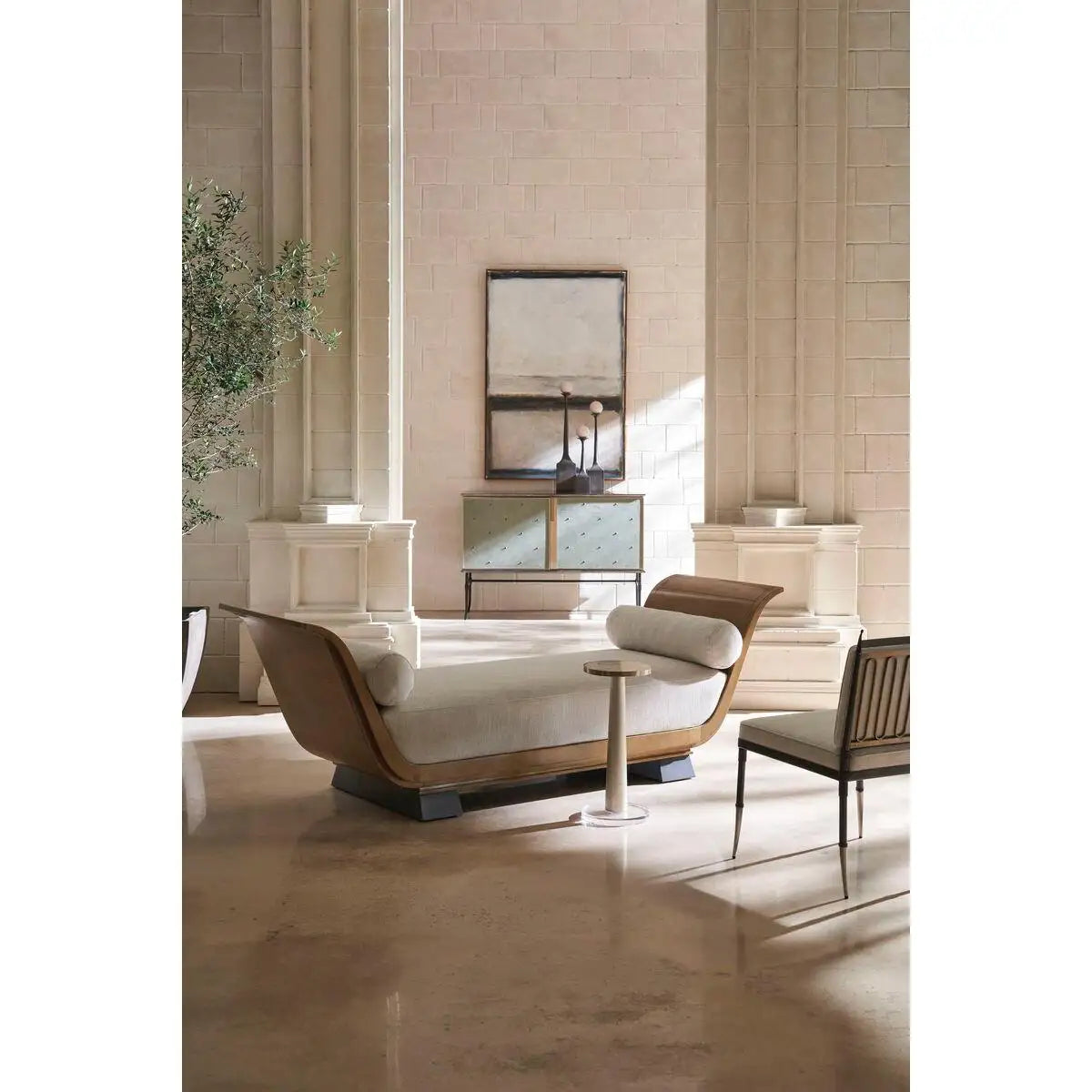 Modern interior design with a sofa, chair, and table in a stylish room.