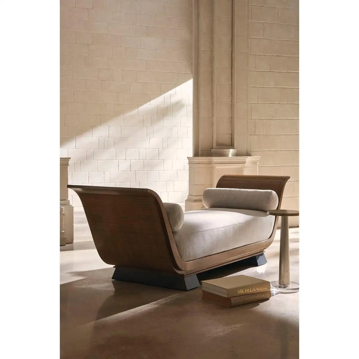 Modern lounge chair with wooden frame and gray cushion in a stylish interior setting.