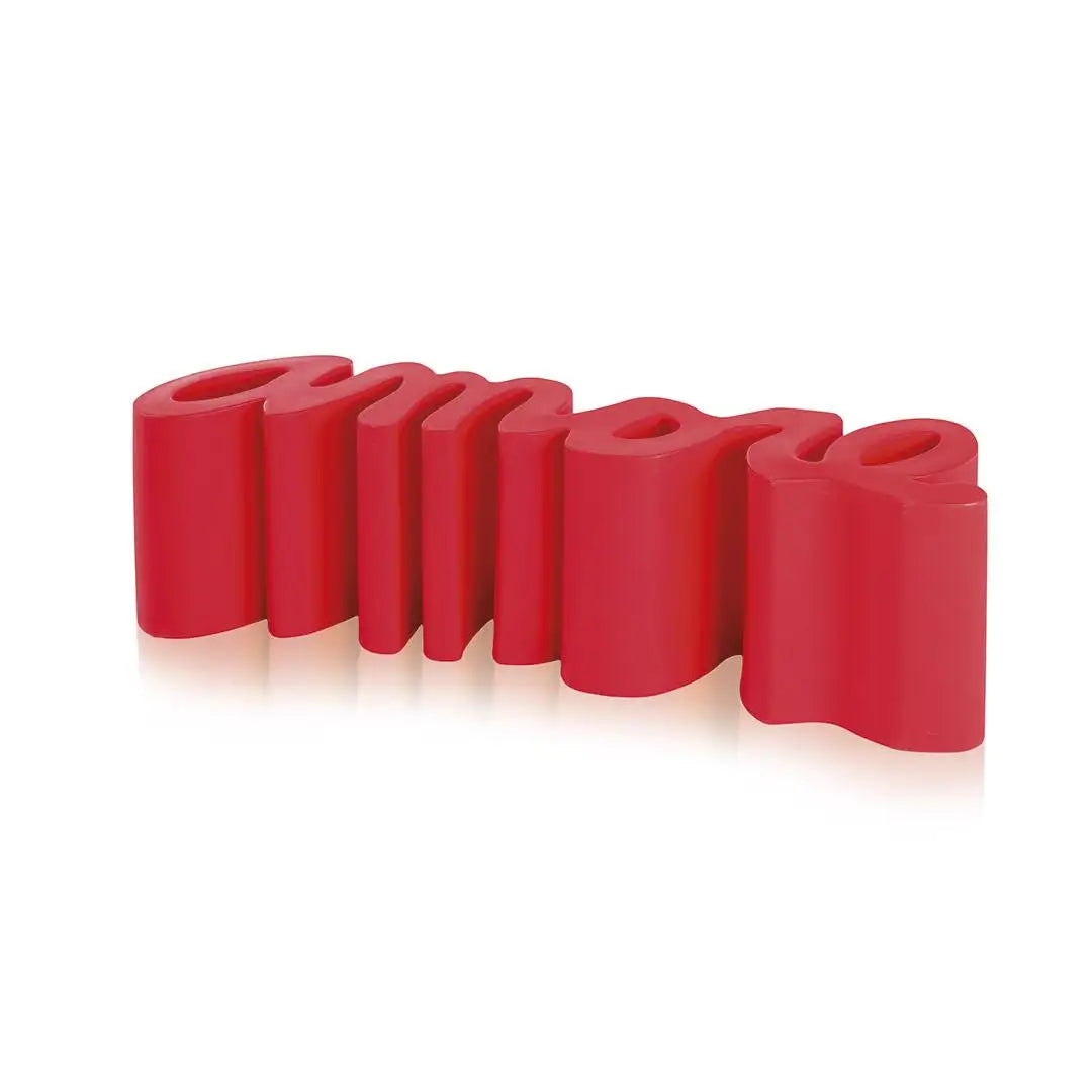 Red silicone bands arranged in a curved pattern on a white background