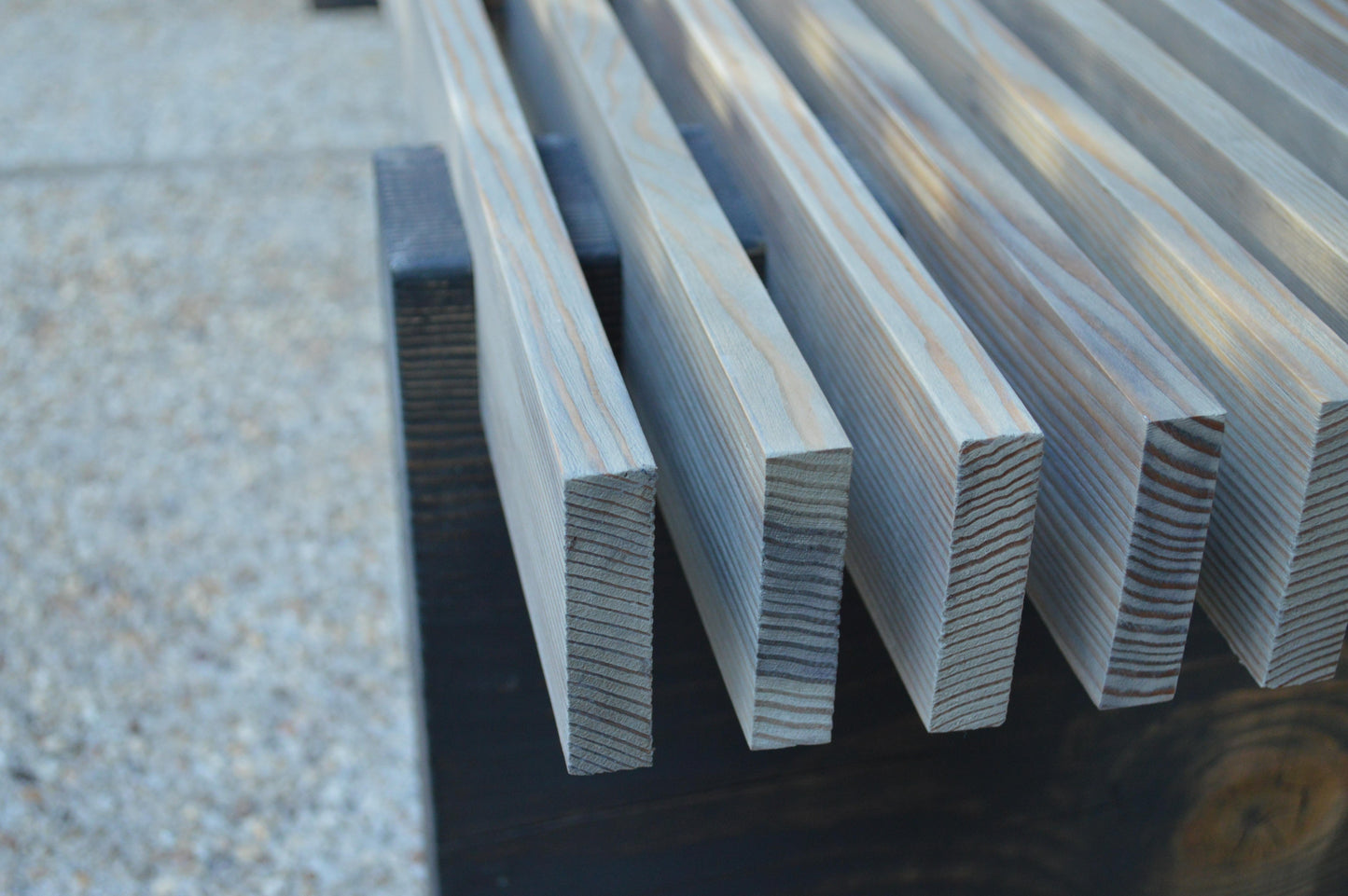 Metal rectangular bars on a textured surface