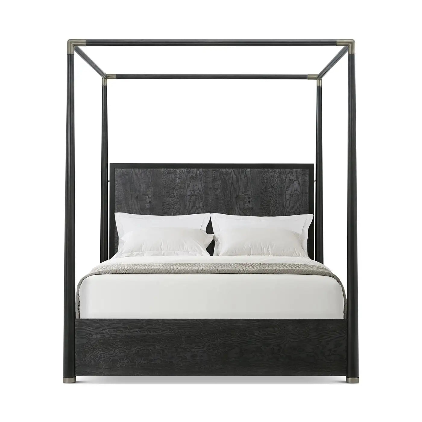 Black metal canopy bed with white bedding on a white background
