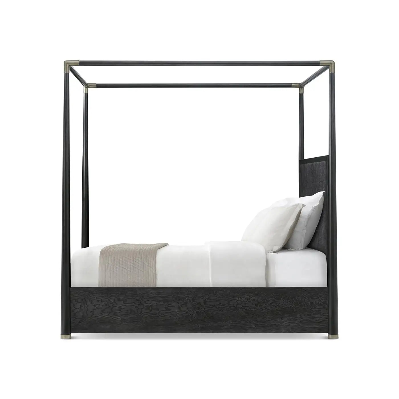 Black metal canopy bed with white bedding on a white background