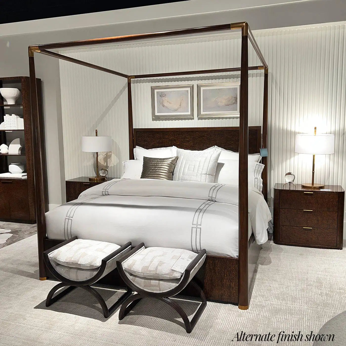 Bedroom with a four-poster bed, nightstands, and ottomans.