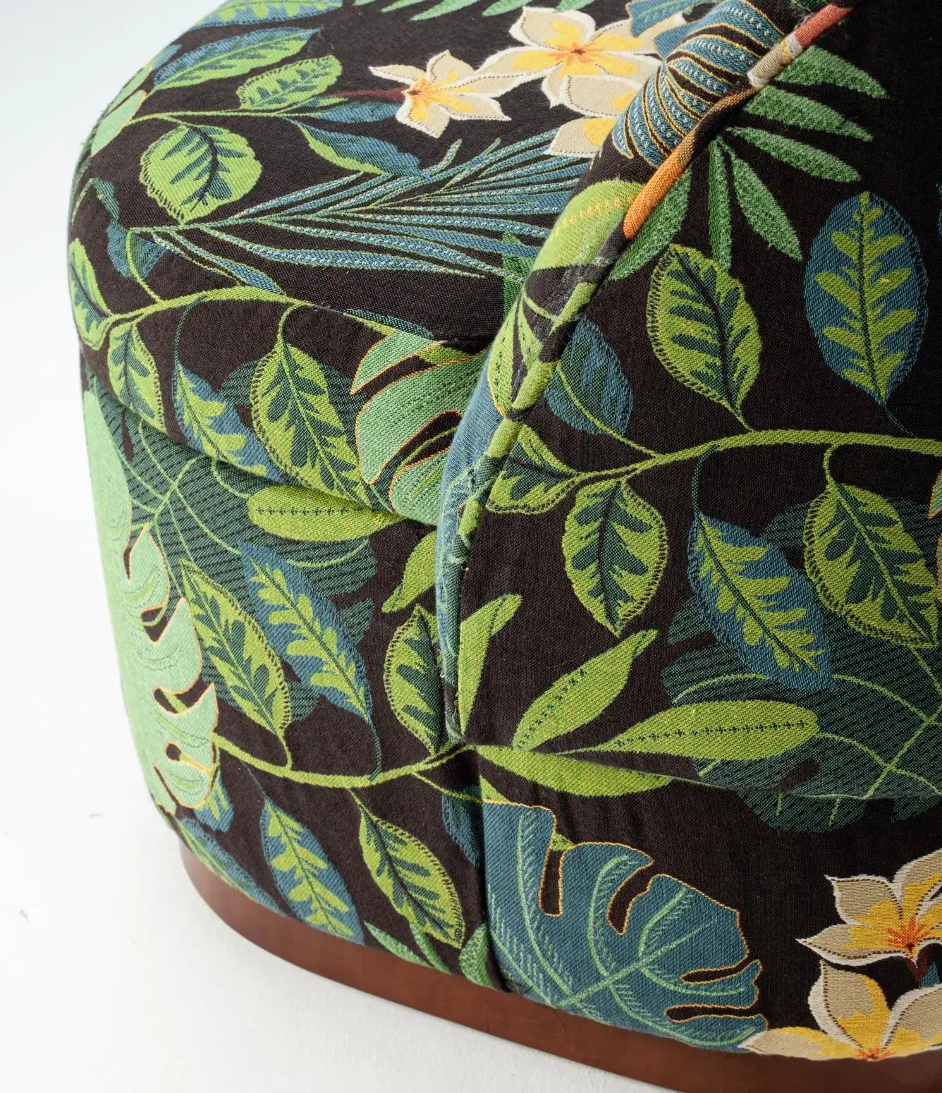 Tropical leaf patterned fabric with flowers on a white background