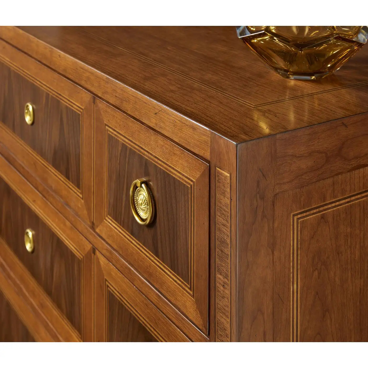 Close-up of a wooden dresser with gold handles
