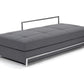 Gray upholstered bench with metal frame on a white background