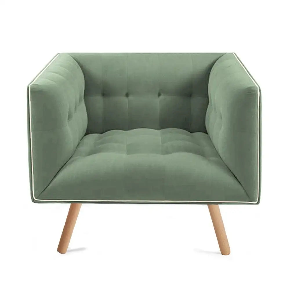 Green armchair with wooden legs on a white background