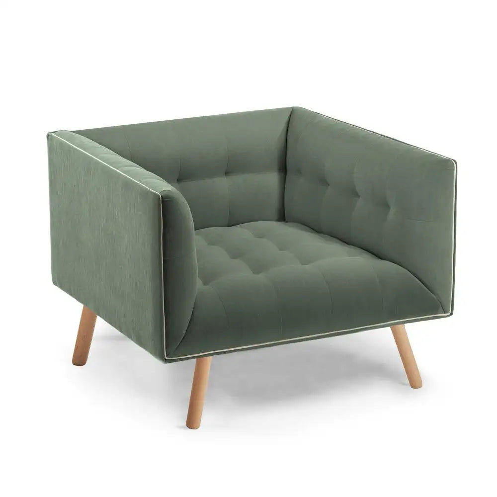 Green armchair with wooden legs on a white background