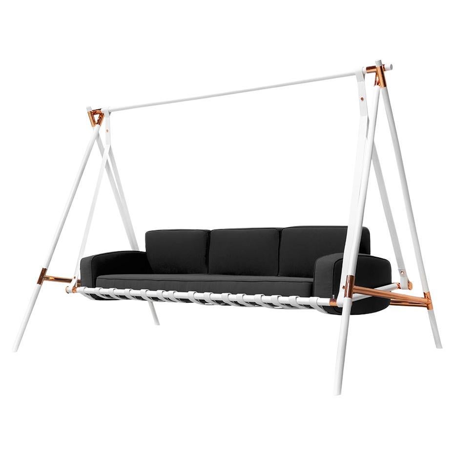 Black sofa on a white swing with copper accents on a white background