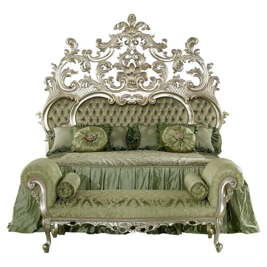 Decorative bed with ornate silver headboard and green bedding on a white background