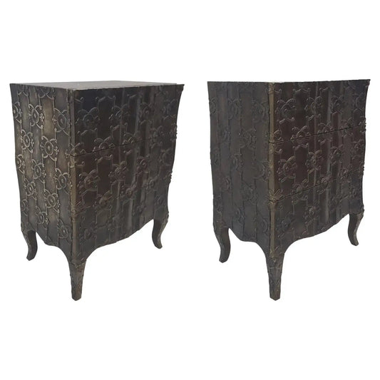 Pair of dark wooden side tables with intricate carvings on a white background