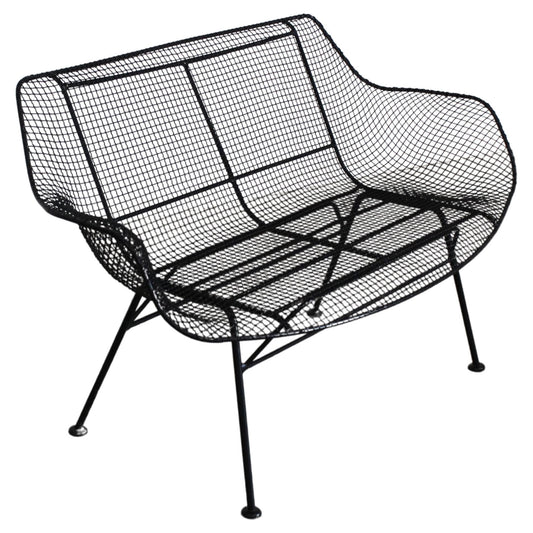 Black wire mesh chair on a white background