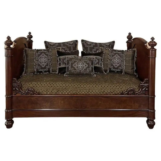 Decorative wooden bed with patterned cushions on a white background