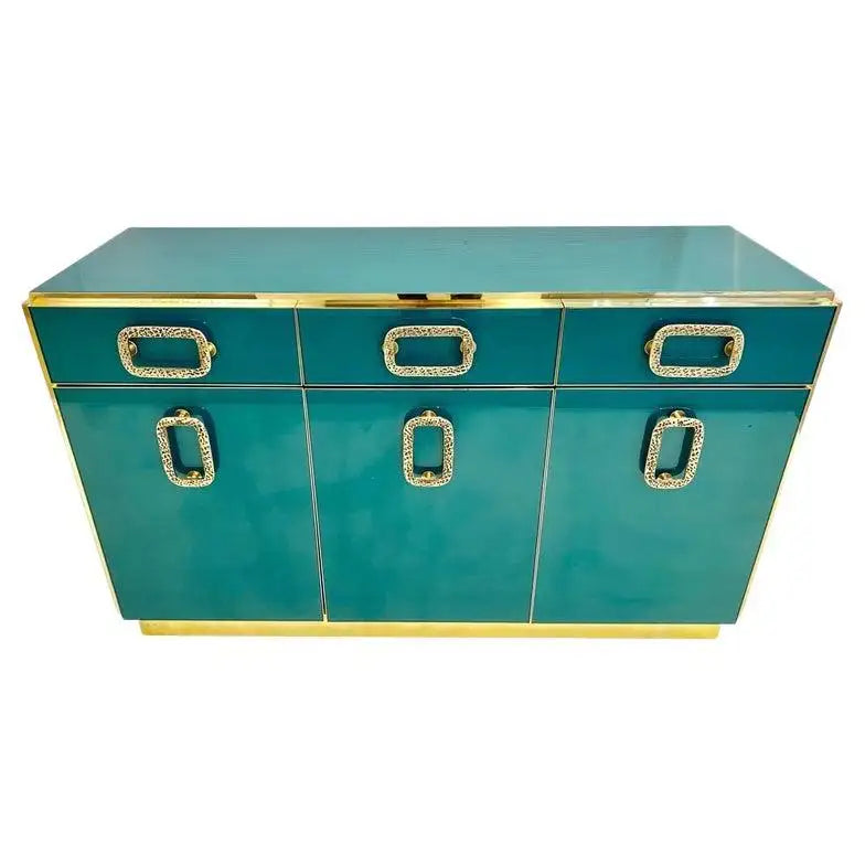 Teal console table with gold accents on a white background