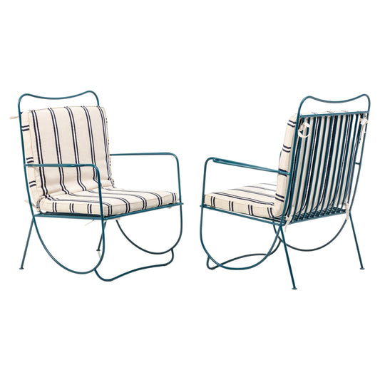 Two metal chairs with striped cushions on a white background