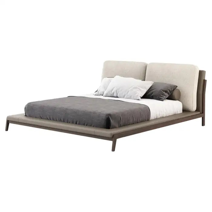 Modern bed with gray bedding and white pillows on a white background