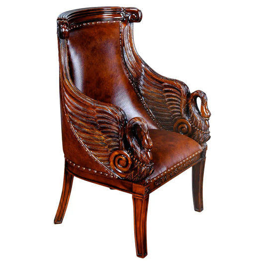 Decorative brown armchair with intricate carvings on a white background