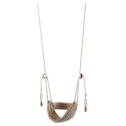 Textured swing with tassels on a white background