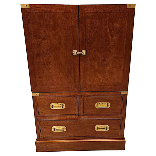 Wooden cabinet with brass hardware on a white background