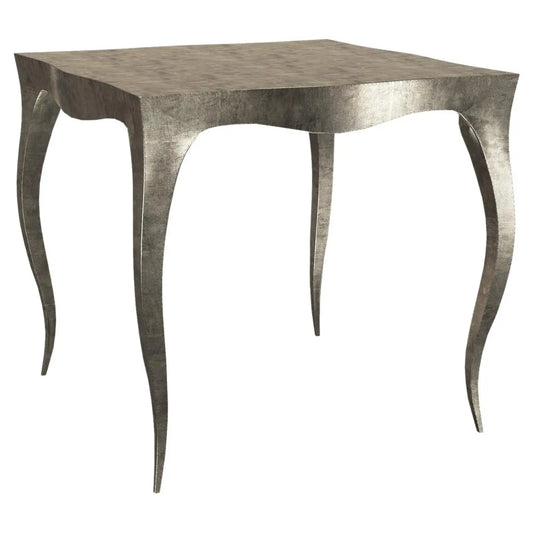 Square table with metallic legs on a white background