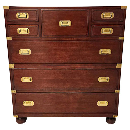 Wooden dresser with gold hardware on a white background