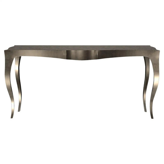 Metallic console table with elegant curved legs on a white background