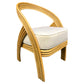 Wicker chair with a white cushion on a white background