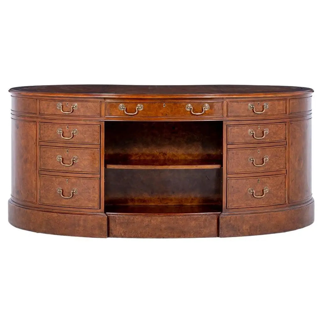 Wooden desk with multiple drawers and a central shelf on a white background