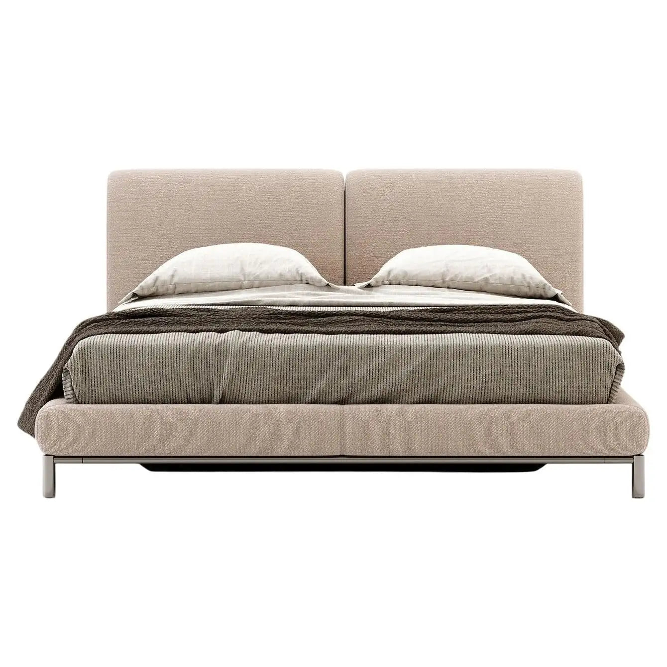 Beige upholstered bed with bedding on a white background