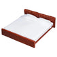 Brown bed frame with white mattress on a white background