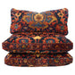 Three patterned cushions stacked on a white background