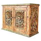 Wooden cabinet with decorative carvings on a white background