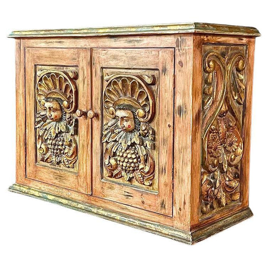 Wooden cabinet with decorative carvings on a white background