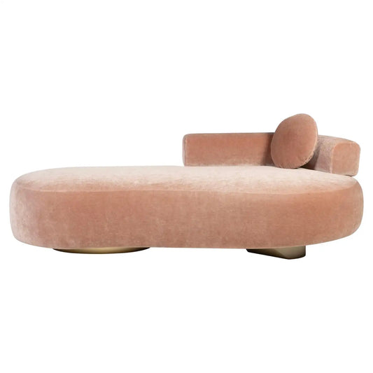 Pink velvet chaise lounge on a white background