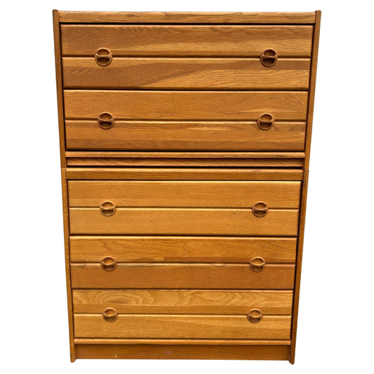Wooden dresser with multiple drawers on a white background