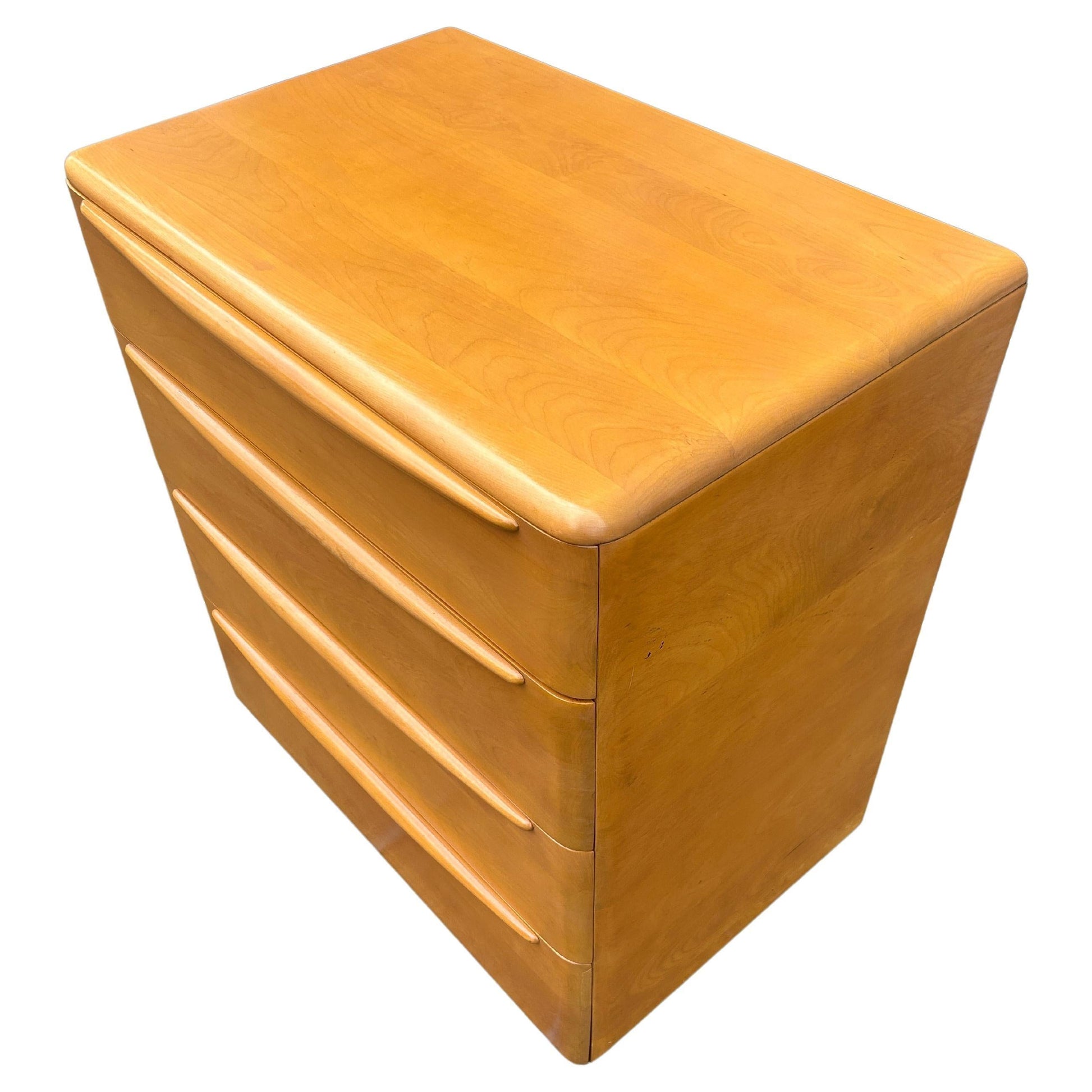 Wooden storage unit with drawers on a white background