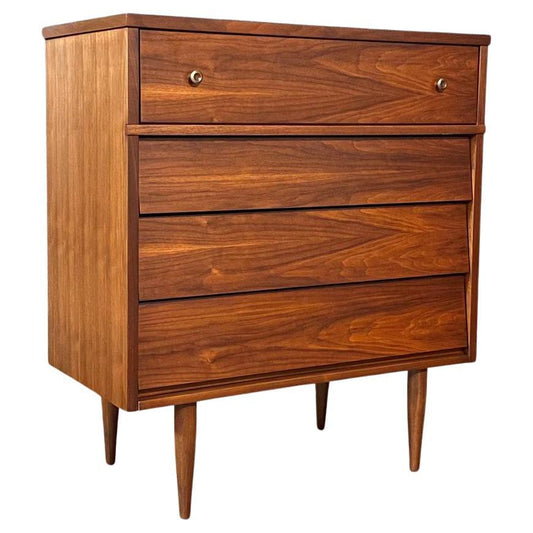 Wooden dresser with four drawers on a white background