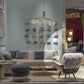 Modern living room with a sectional sofa, armchair, and decorative items.