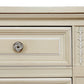 Close-up of a wooden drawer with decorative trim and a knob on a white background