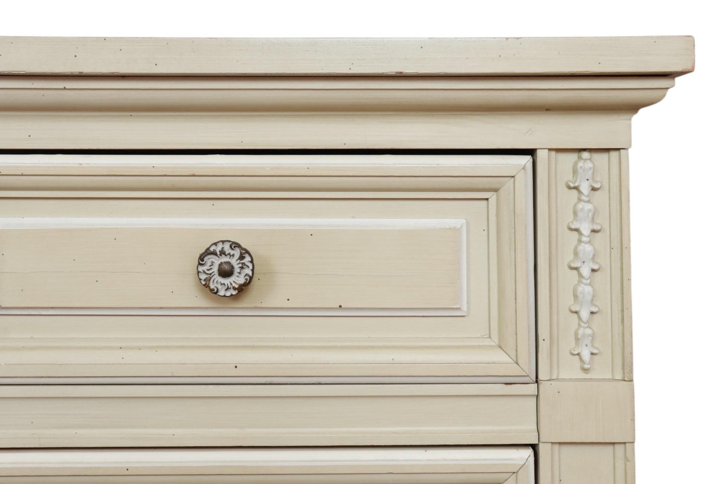 Close-up of a wooden drawer with decorative trim and a knob on a white background