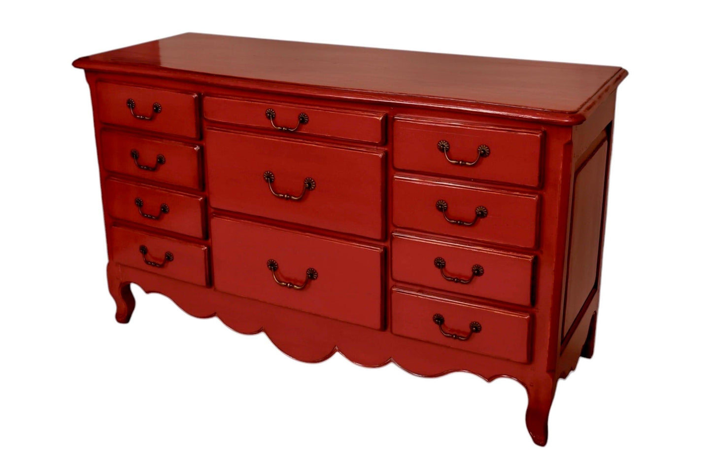 Red dresser with multiple drawers on a white background