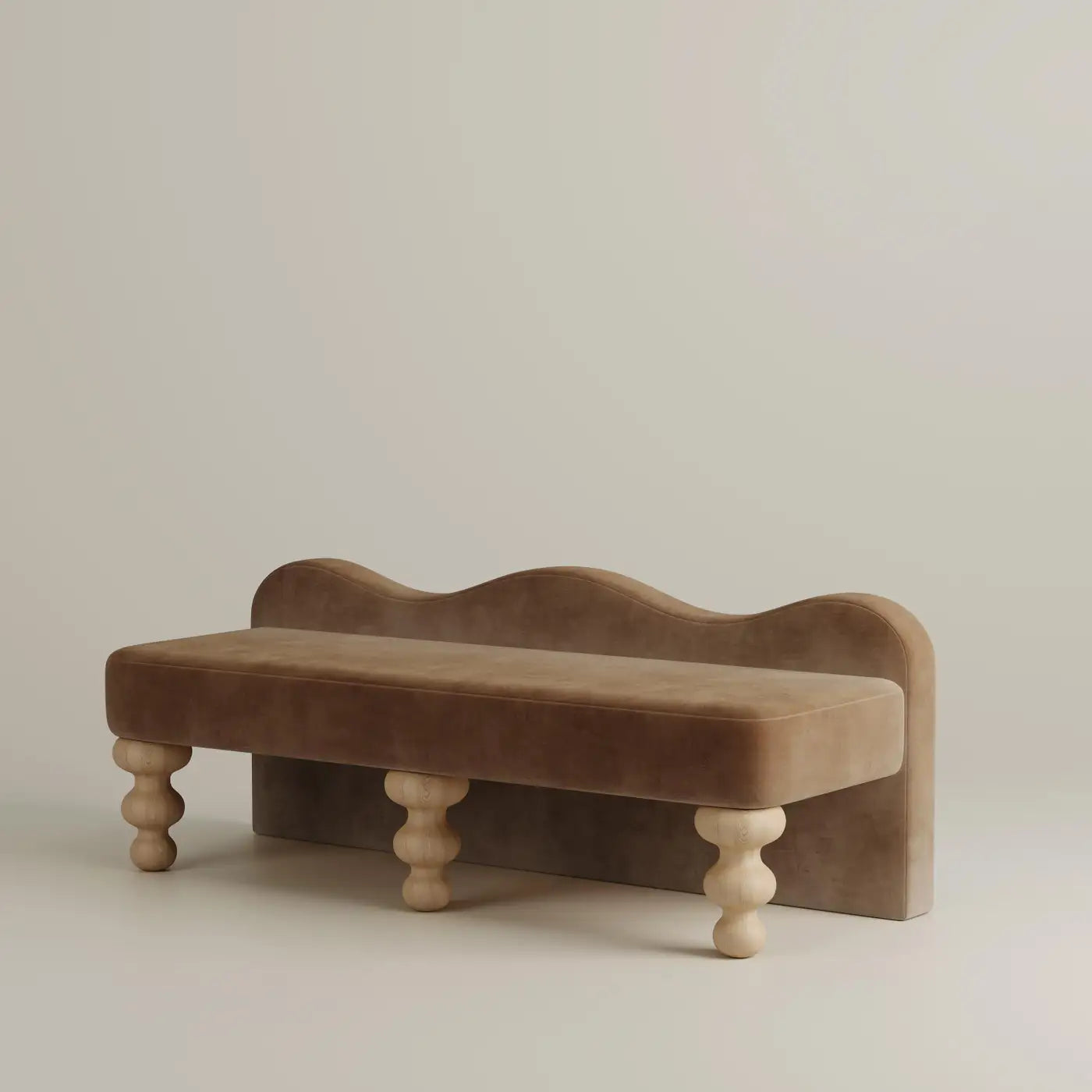 Brown velvet bench with wooden legs on a beige background