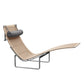 Modern lounge chair with wicker seat and gray cushion on a white background