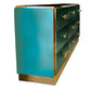 Teal and gold dresser with multiple drawers on a white background